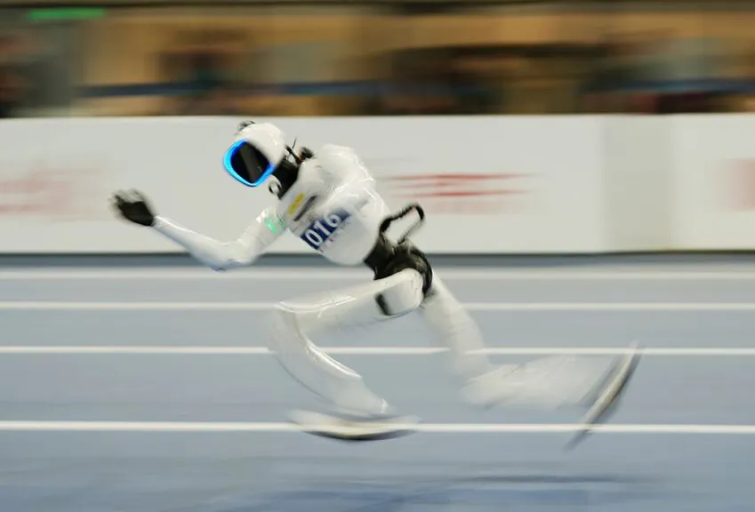 BEIJING, CHINA - AUGUST 23: Humanoid robots compete in the track and field event on day 2 of the 2nd World Humanoid Robot Games at National Speed Skating Oval on August 23, 2026 in Beijing, China. (Photo by Cui Jun/Beijing Youth Daily/VCG via Getty Images)