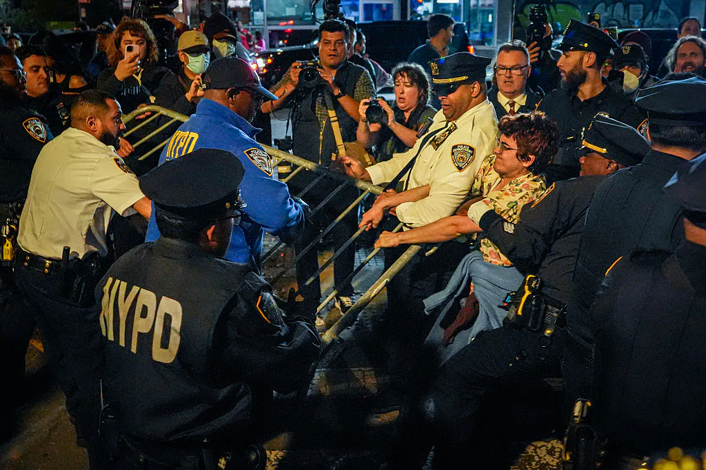 NEW YORK, NEW YORK - OCTOBER 08: Protesters clash with NYPD officers after a man was shot by an Immigration and Customs Enforcement (ICE) officer during an operation in the Bronx, on October 8, 2026, in New York City. According to local media and the NYPD, the driver was shot, conscious, and transported to a local hospital. 