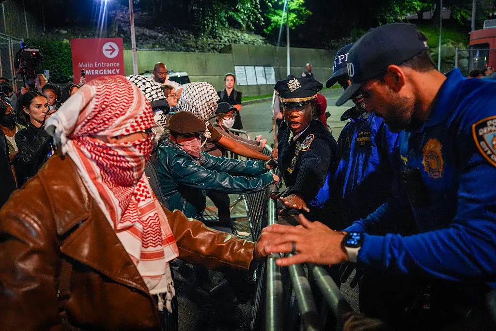 NEW YORK, NEW YORK - OCTOBER 08: Protesters clash with NYPD officers after a man was shot by an Immigration and Customs Enforcement (ICE) officer during an operation in the Bronx, on October 8, 2026, in New York City. According to local media and the NYPD, the driver was shot, conscious, and transported to a local hospital. 