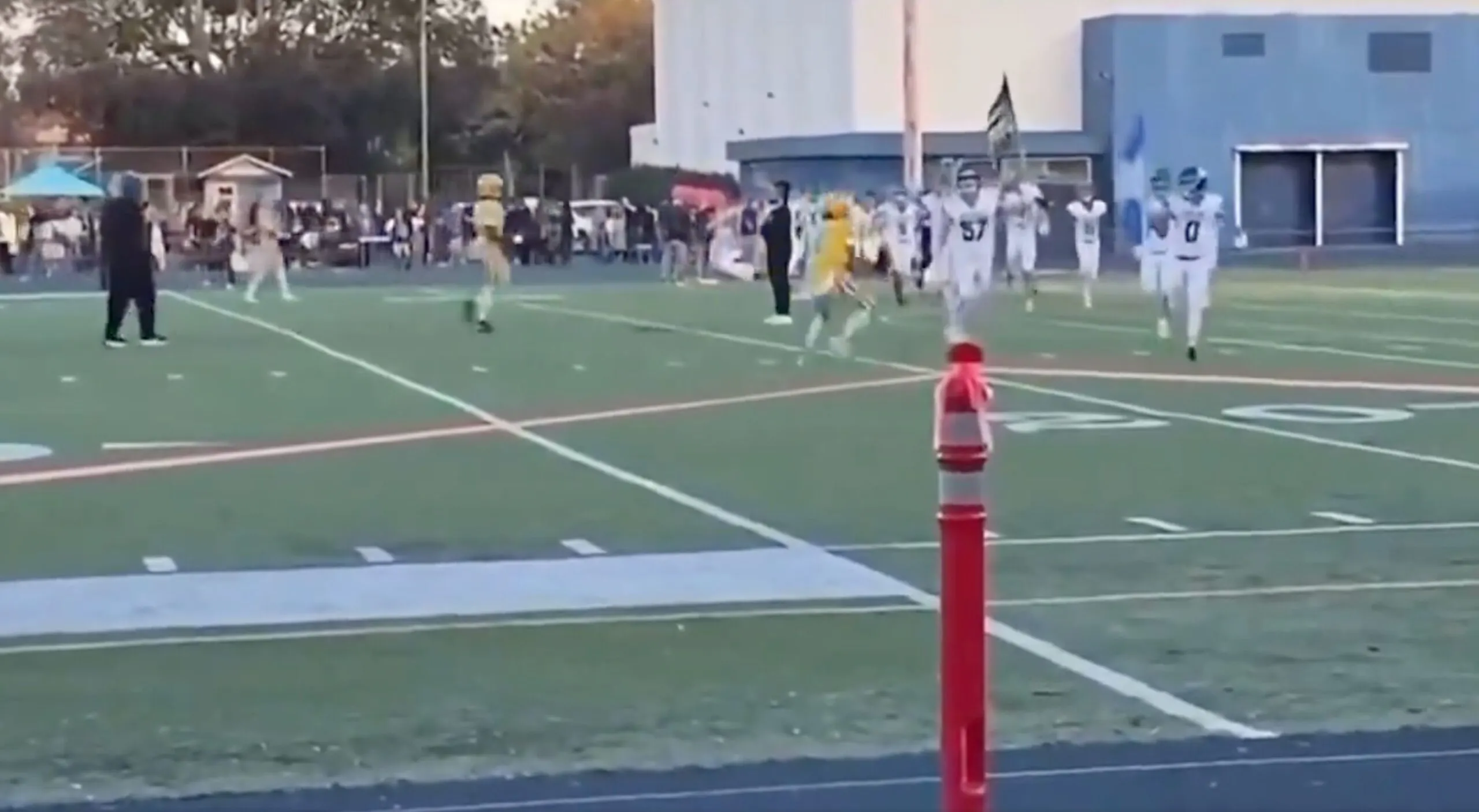 WATCH: ‘Democrats’ Football Player Levels Rival Carrying American Flag In Dirty Pre-Game Hit